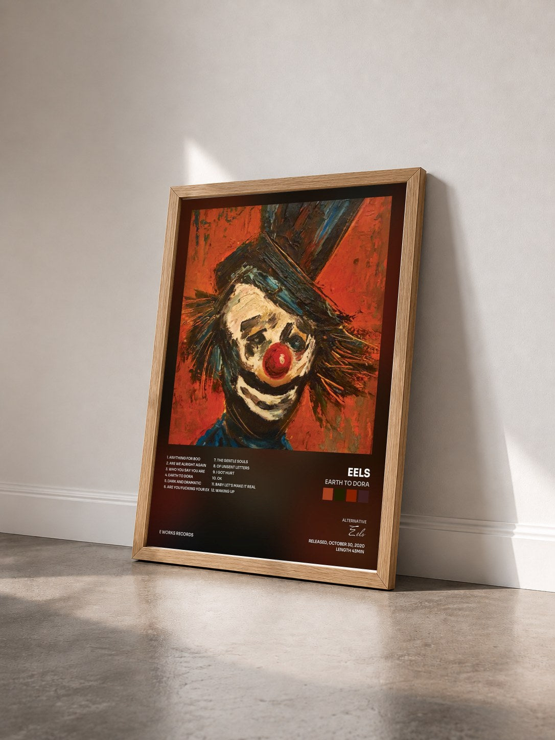 #bois Tableau de l'album Earth to Dora de Eels vu de trois quarts, cadre en bois brut