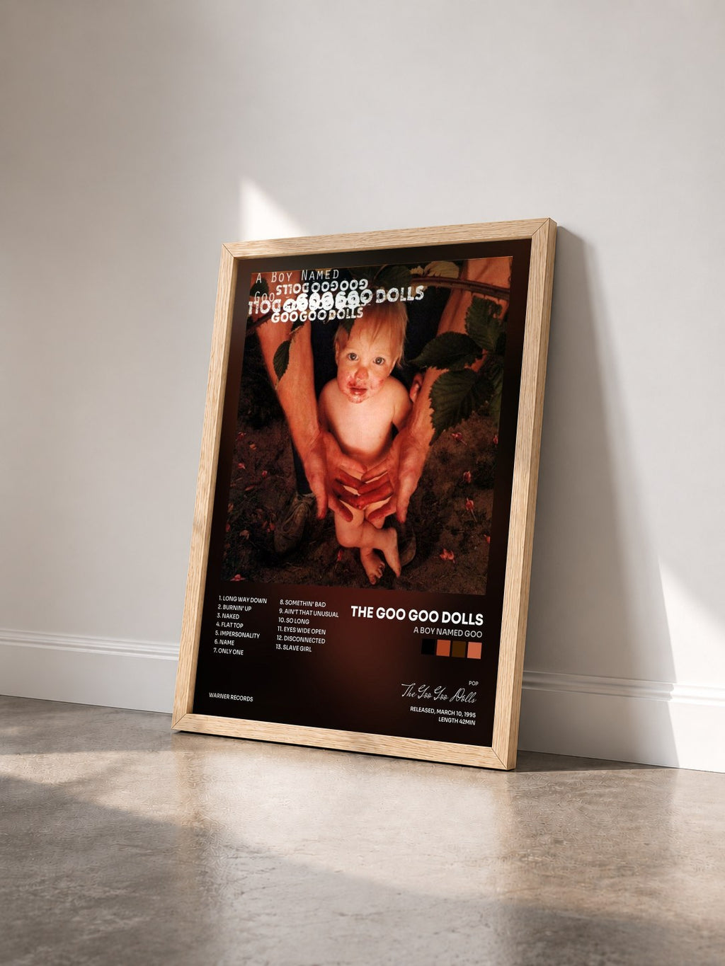 #bois Tableau de l'album A Boy Named Goo de The Goo Goo Dolls vu de trois quarts, cadre en bois brut