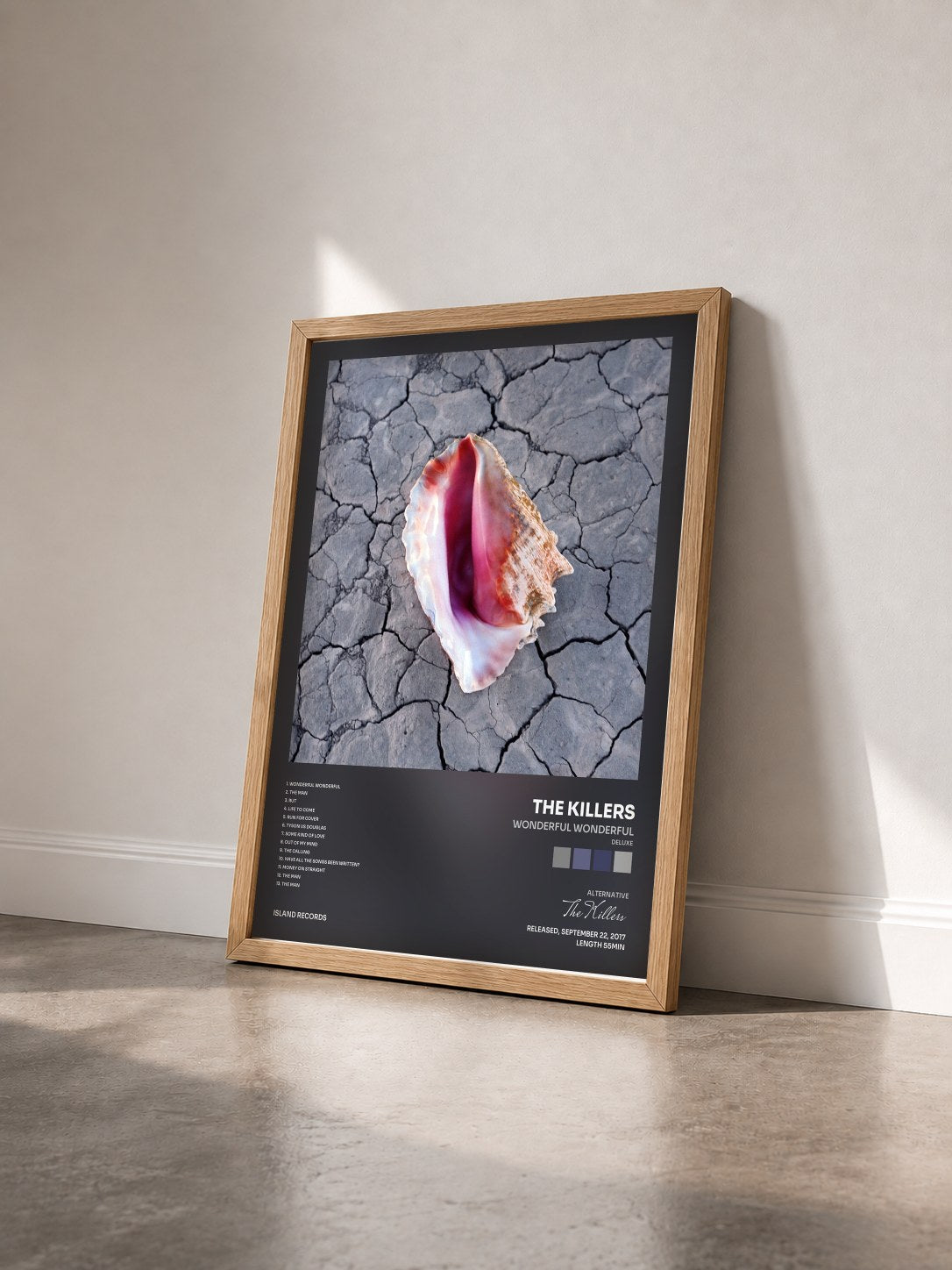 #bois Tableau de l'album Wonderful Wonderful (Deluxe) de The Killers vu de trois quarts, cadre en bois brut