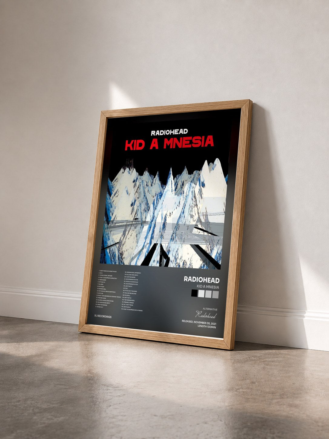 #bois Tableau de l'album KID A MNESIA de Radiohead vu de trois quarts, cadre en bois brut