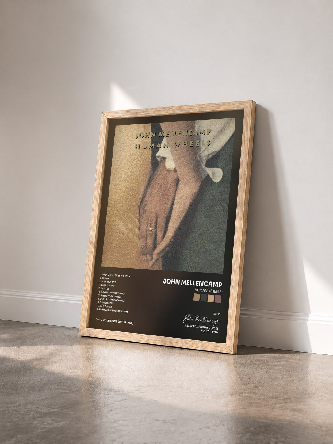 #bois Tableau de l'album Human Wheels de John Mellencamp vu de trois quarts, cadre en bois brut