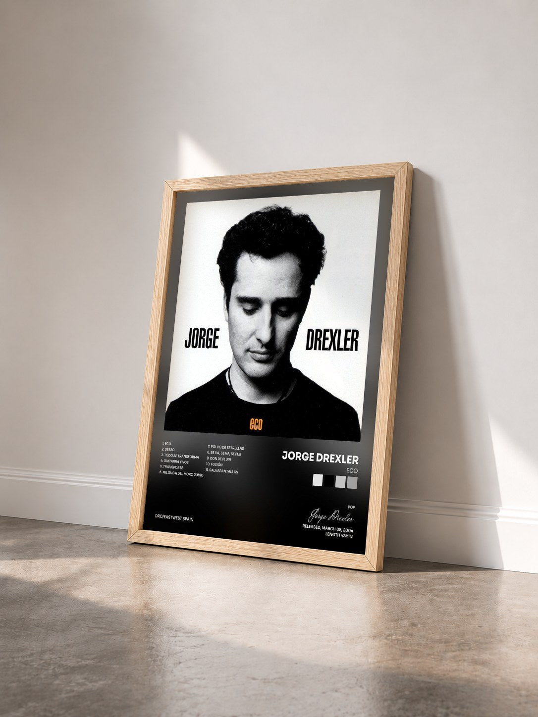 #bois Tableau de l'album Eco de Jorge Drexler vu de trois quarts, cadre en bois brut
