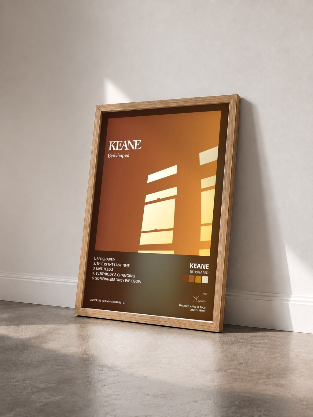#bois Tableau de l'album Bedshaped de Keane vu de trois quarts, cadre en bois brut