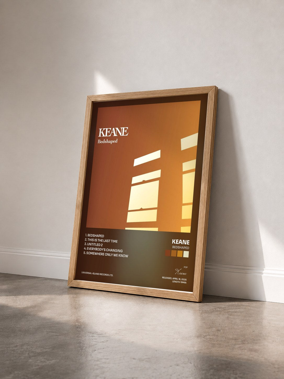 #bois Tableau de l'album Bedshaped de Keane vu de trois quarts, cadre en bois brut
