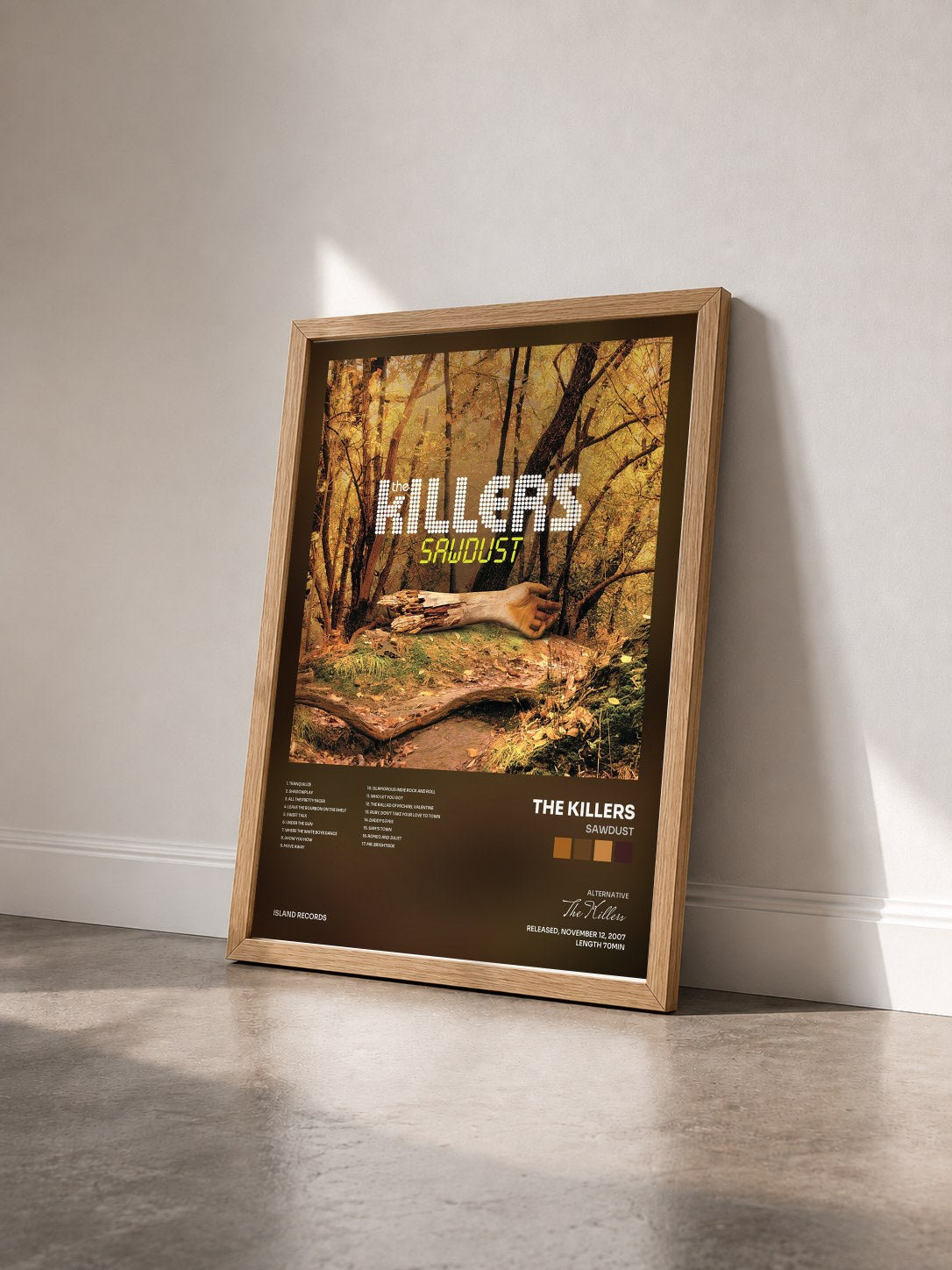 #bois Tableau de l'album Sawdust de The Killers vu de trois quarts, cadre en bois brut