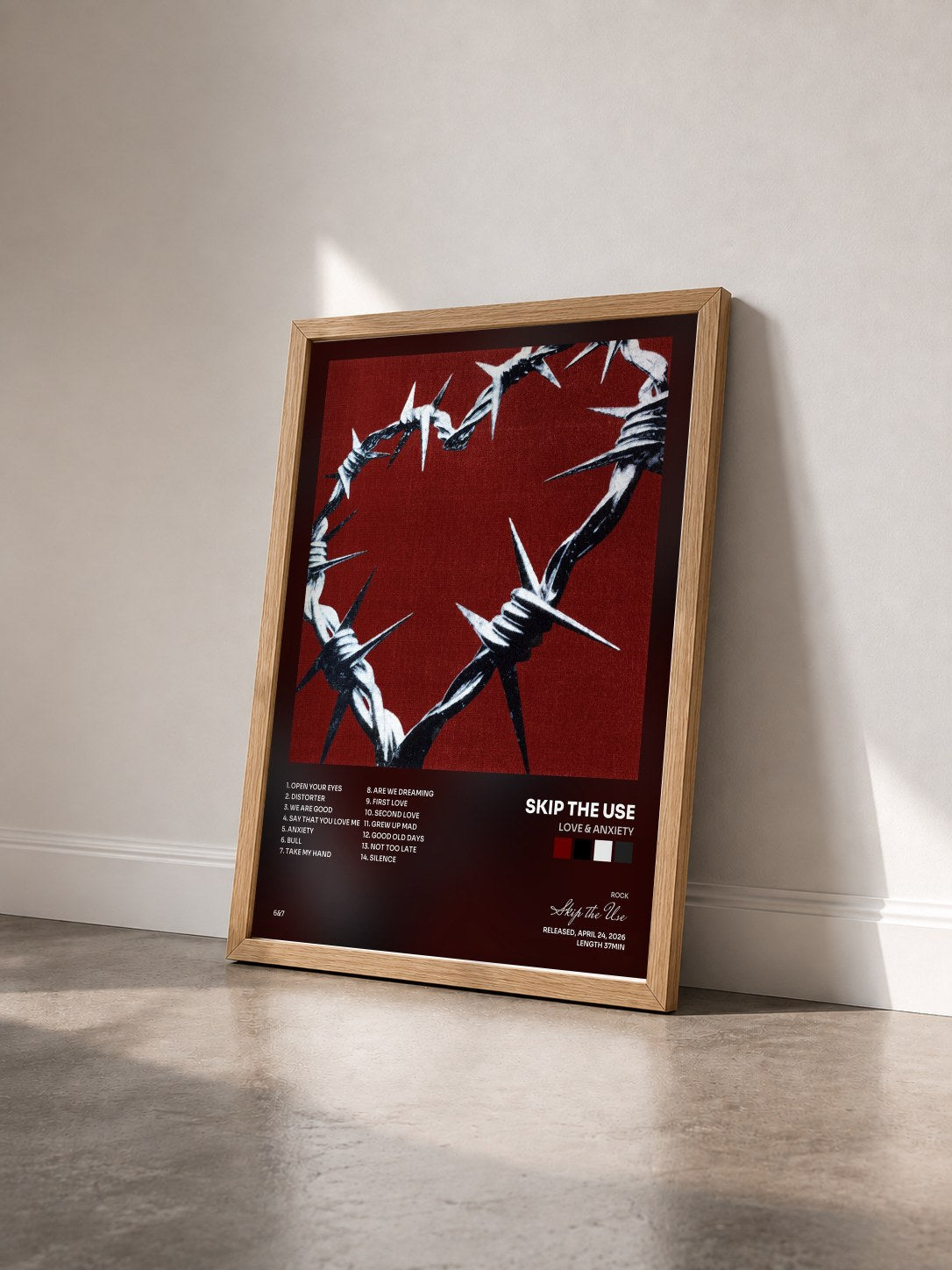 #bois Tableau de l'album LOVE & ANXIETY de Skip the Use vu de trois quarts, cadre en bois brut