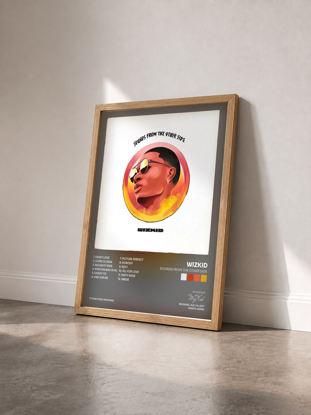 #bois Tableau de l'album Sounds From The Other Side de WizKid vu de trois quarts, cadre en bois brut