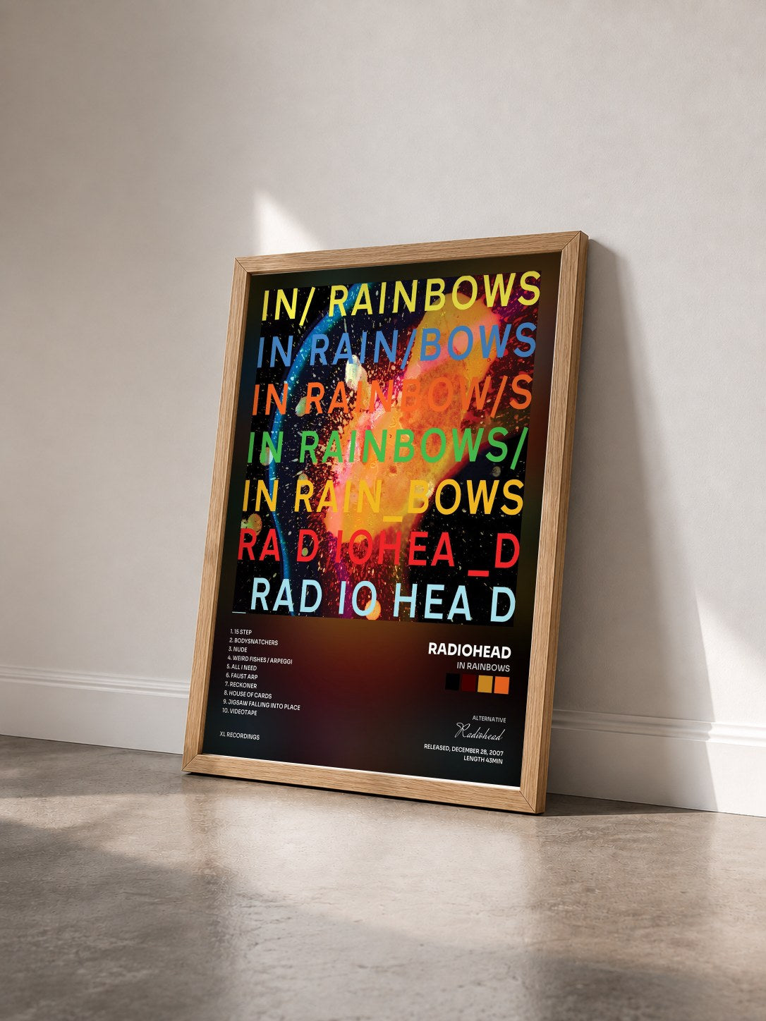 #bois Tableau de l'album In Rainbows de Radiohead vu de trois quarts, cadre en bois brut