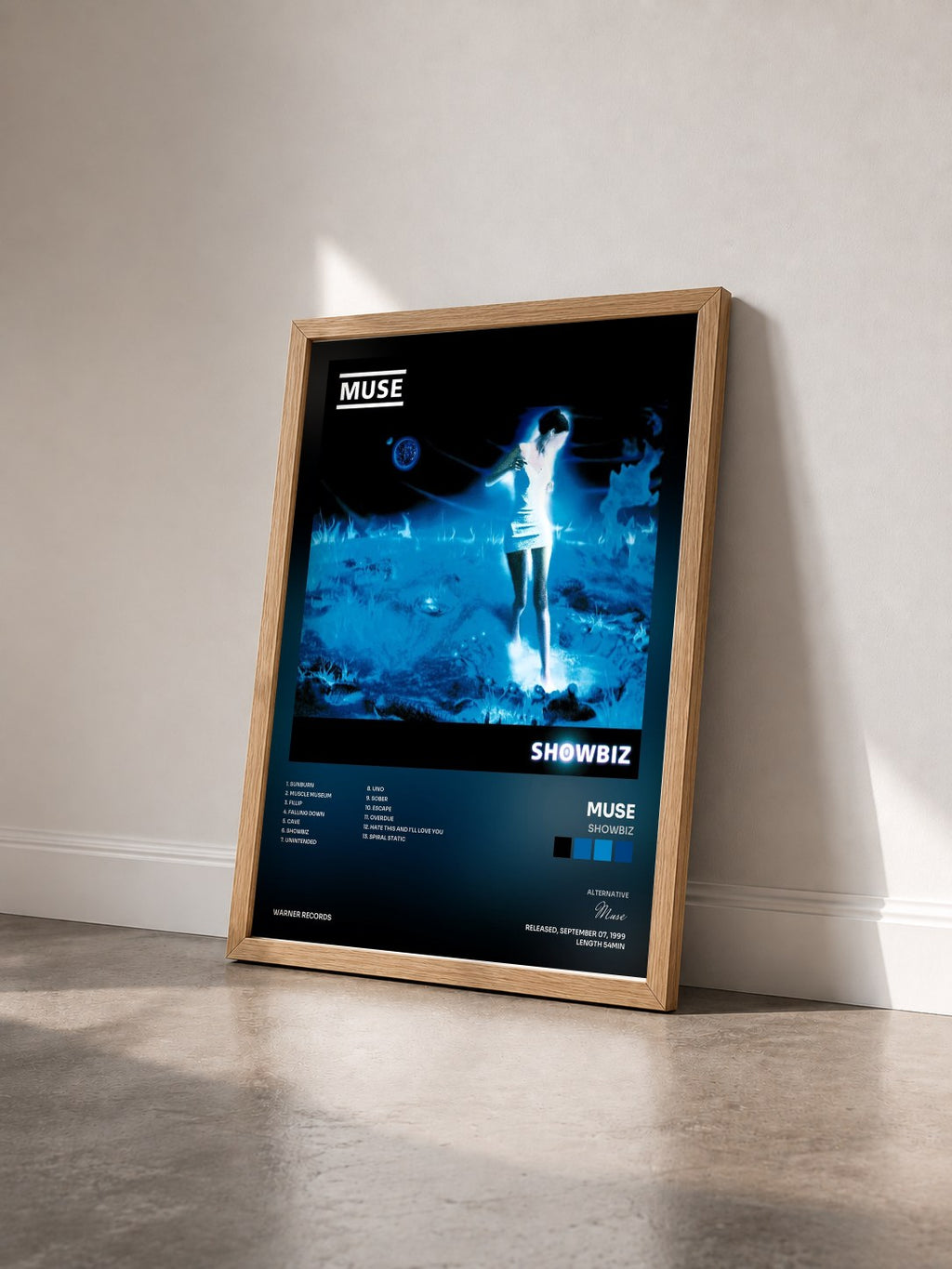 #bois Tableau de l'album Showbiz de Muse vu de trois quarts, cadre en bois brut