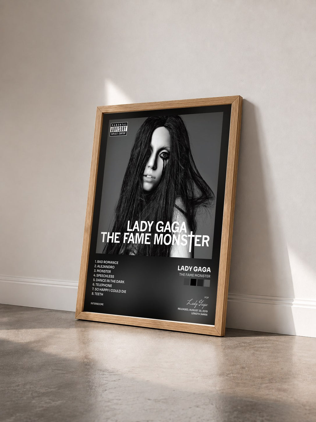#bois Tableau de l'album The Fame Monster de Lady Gaga vu de trois quarts, cadre en bois brut