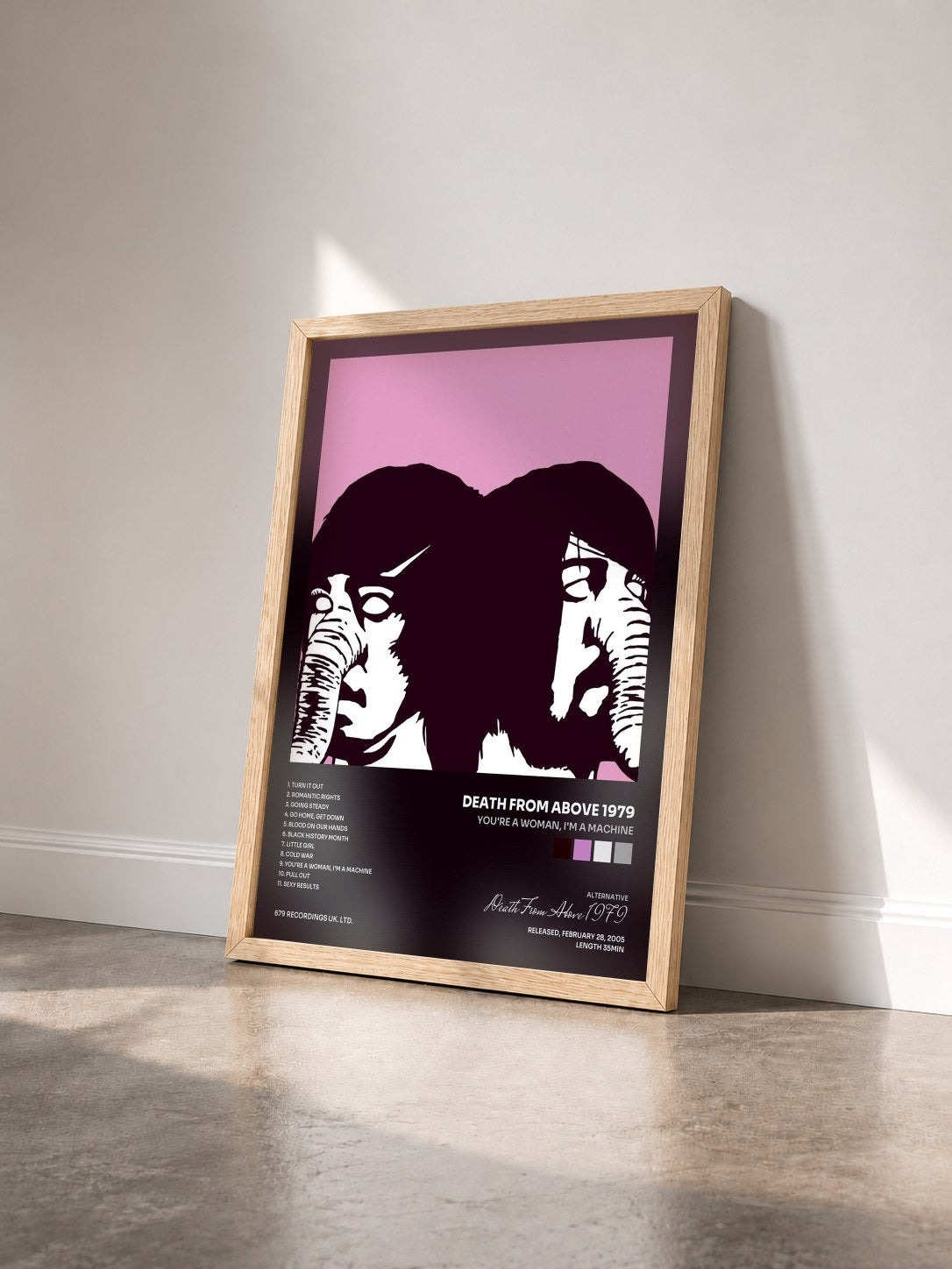 #bois Tableau de l'album You're A Woman, I'm A Machine de Death From Above 1979 vu de trois quarts, cadre en bois brut