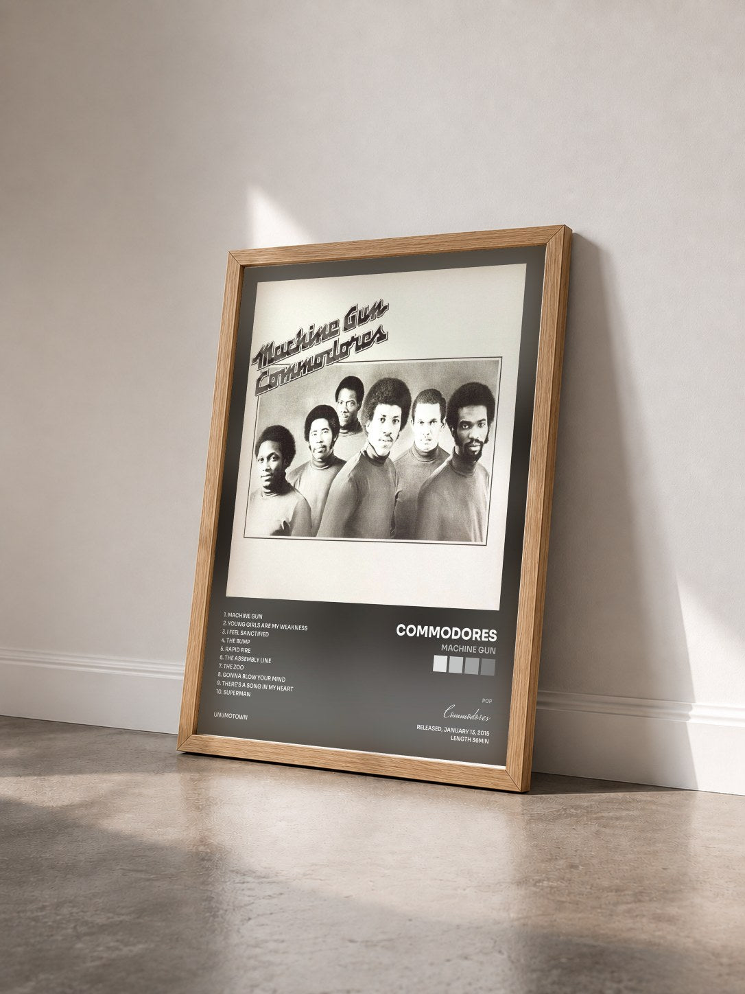 #bois Tableau de l'album Machine Gun de Commodores vu de trois quarts, cadre en bois brut