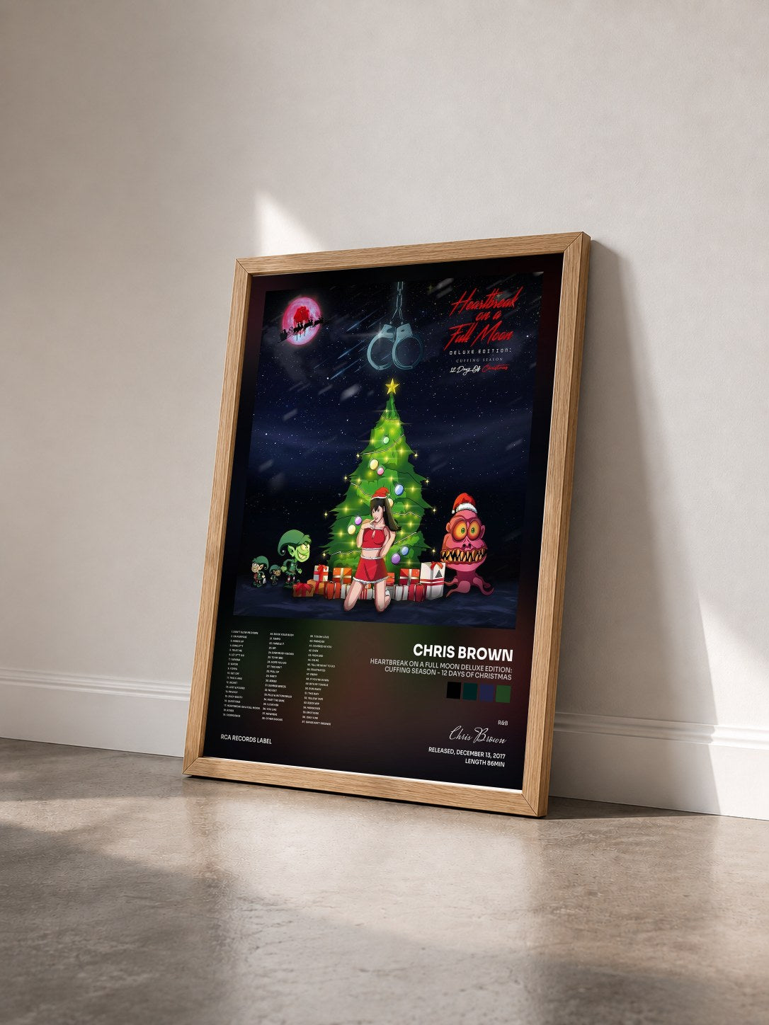 #bois Tableau de l'album Heartbreak On A Full Moon Deluxe Edition: Cuffing Season - 12 Days Of Christmas de Chris Brown vu de trois quarts, cadre en bois brut