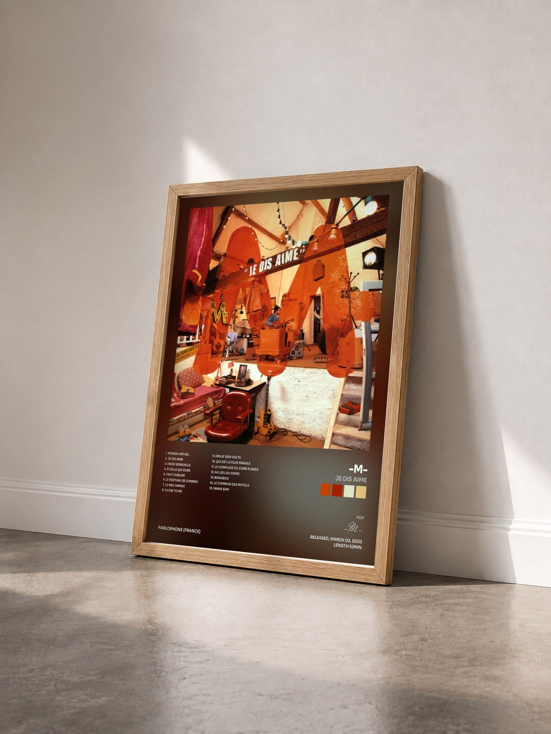 #bois Tableau de l'album Je Dis Aime de -M- vu de trois quarts, cadre en bois brut