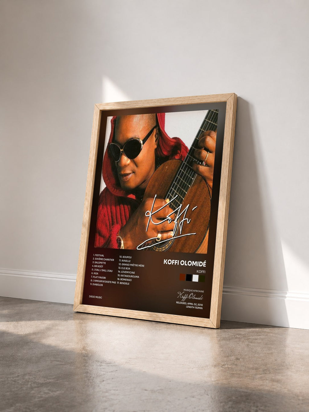 #bois Tableau de l'album Koffi de Koffi Olomidé vu de trois quarts, cadre en bois brut
