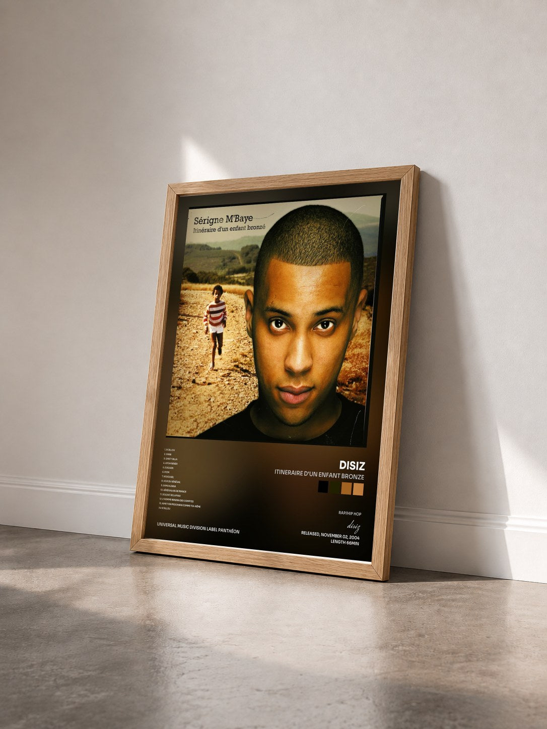 #bois Tableau de l'album Itineraire D'Un Enfant Bronze de disiz vu de trois quarts, cadre en bois brut
