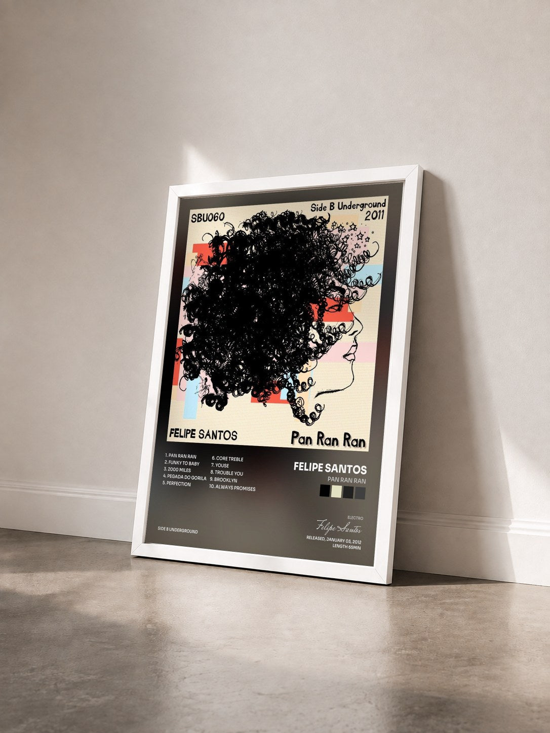 #blanc Tableau de l'album Pan Ran Ran de Felipe Santos vu de trois quarts, cadre blanc
