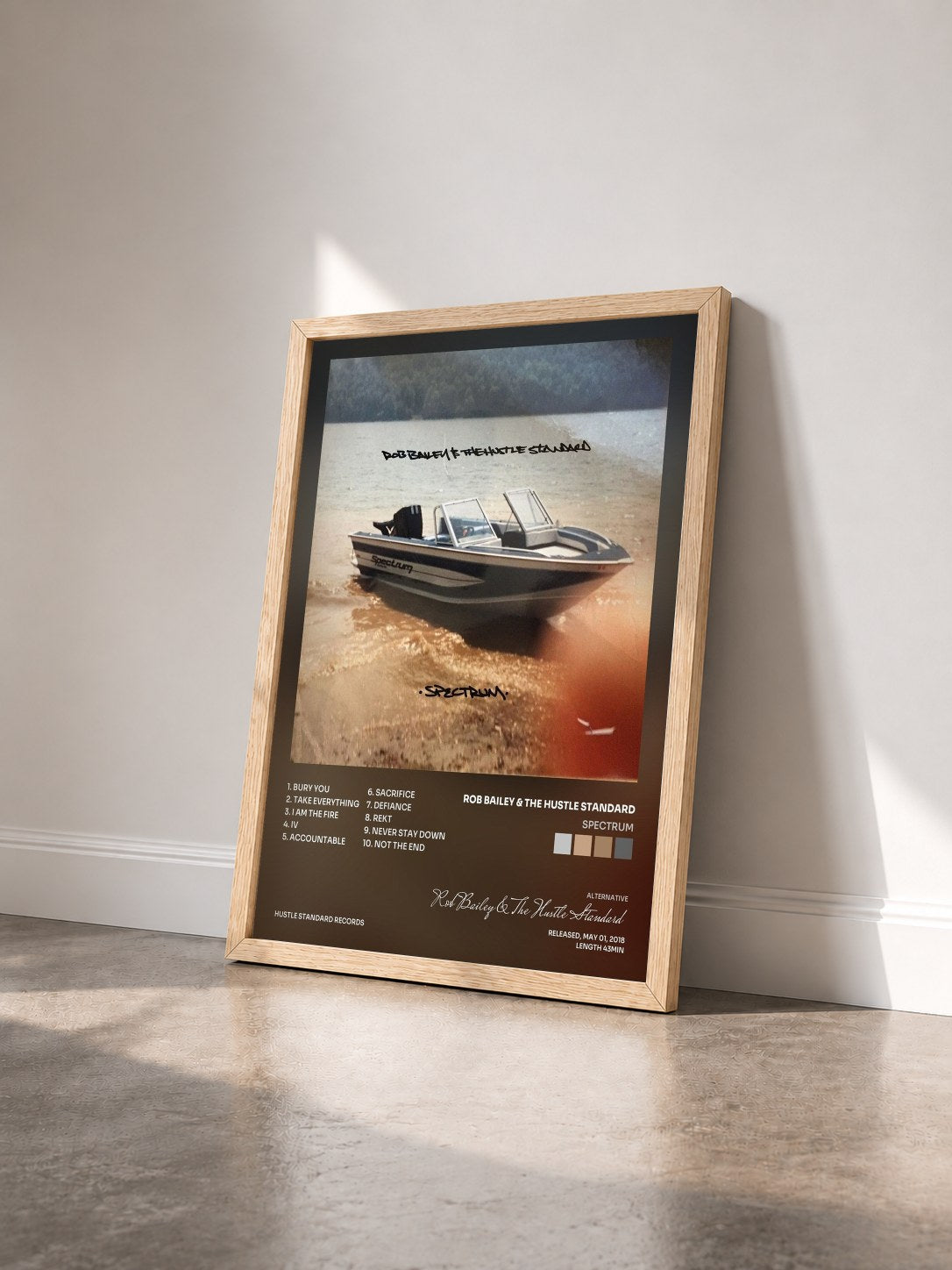 #bois Tableau de l'album Spectrum de Rob Bailey & The Hustle Standard vu de trois quarts, cadre en bois brut