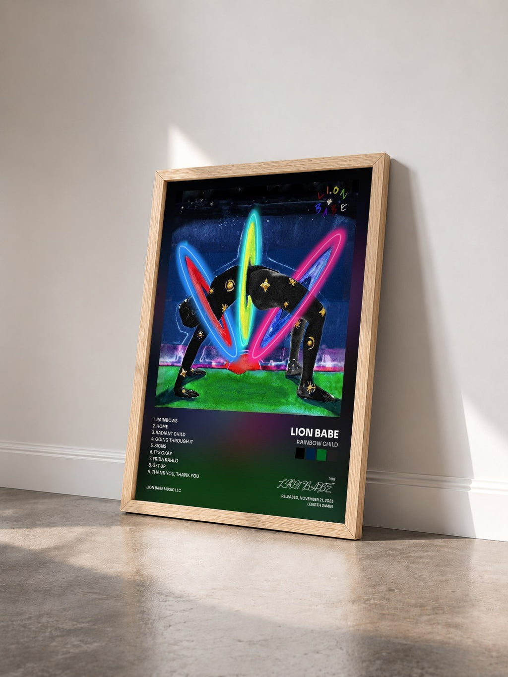 #bois Tableau de l'album Rainbow Child de LION BABE vu de trois quarts, cadre en bois brut