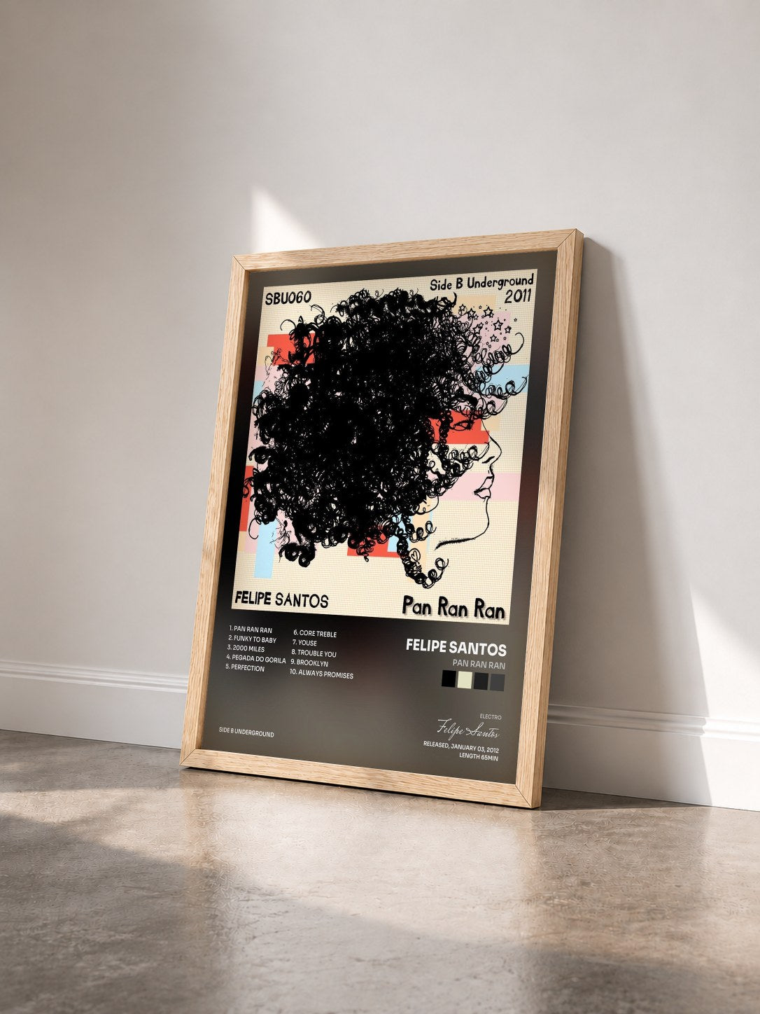 #bois Tableau de l'album Pan Ran Ran de Felipe Santos vu de trois quarts, cadre en bois brut