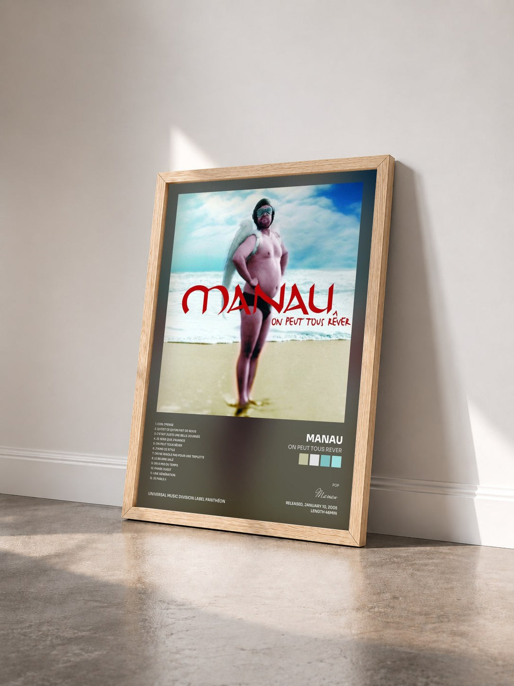 #bois Tableau de l'album On Peut Tous Rever de Manau vu de trois quarts, cadre en bois brut
