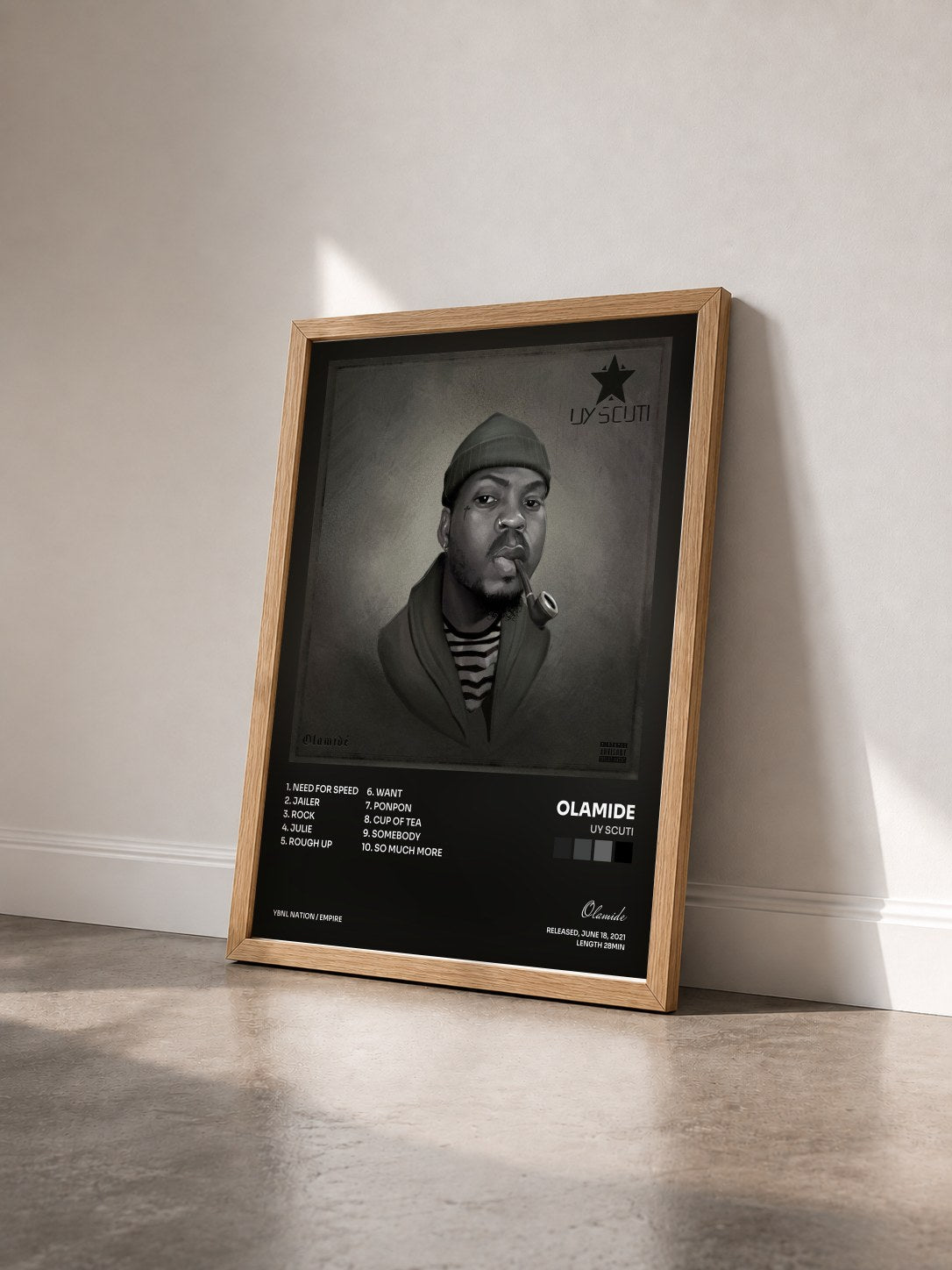 #bois Tableau de l'album UY Scuti de Olamide vu de trois quarts, cadre en bois brut