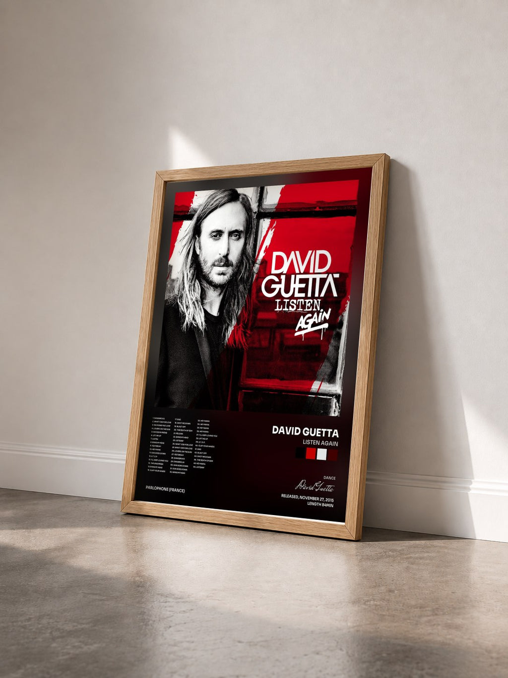 #bois Tableau de l'album Listen Again de David Guetta vu de trois quarts, cadre en bois brut
