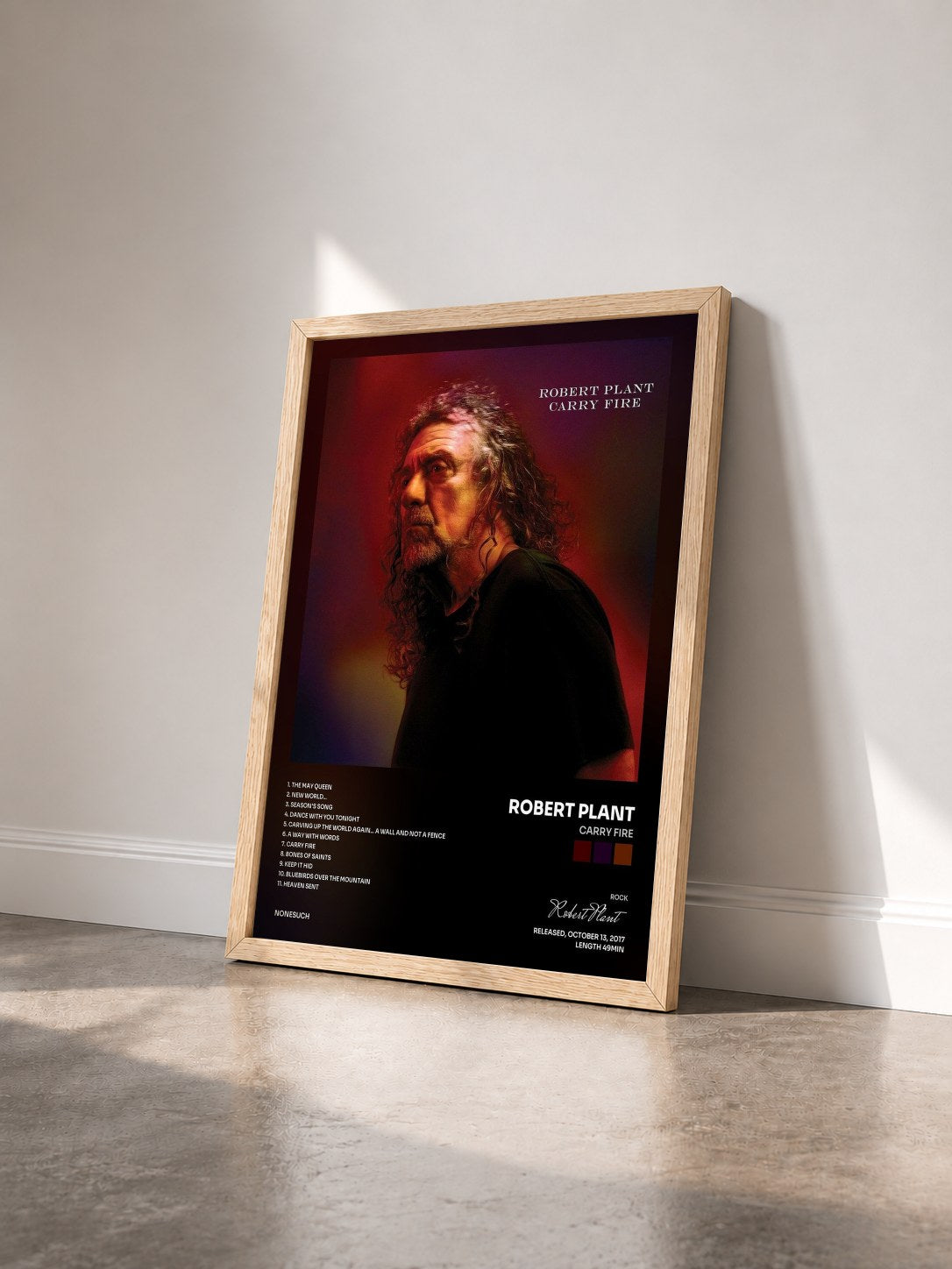#bois Tableau de l'album Carry Fire de Robert Plant vu de trois quarts, cadre en bois brut