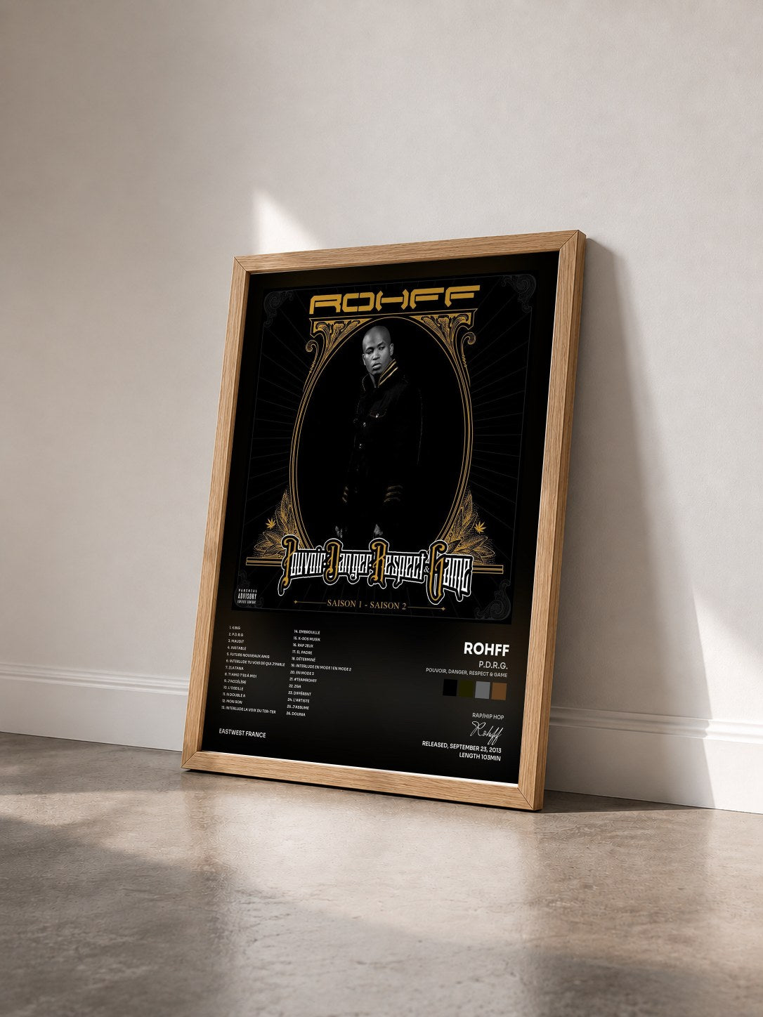 #bois Tableau de l'album P.D.R.G. (Pouvoir, Danger, Respect & Game) de Rohff vu de trois quarts, cadre en bois brut