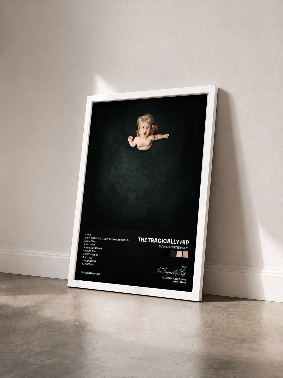 #blanc Tableau de l'album Man Machine Poem de The Tragically Hip vu de trois quarts, cadre blanc