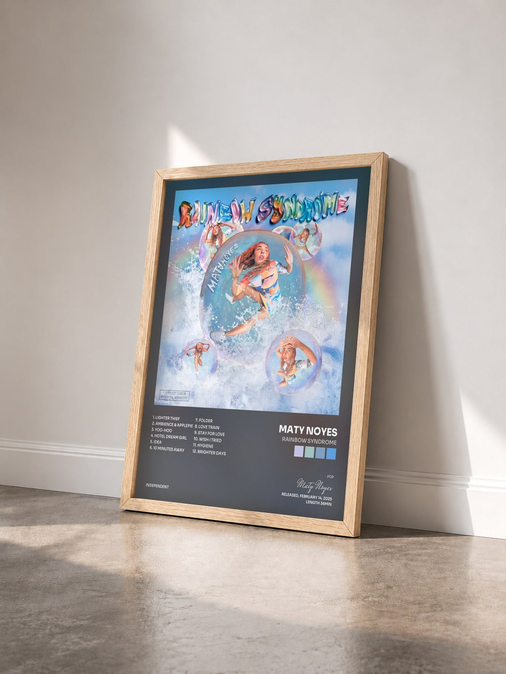 #bois Tableau de l'album Rainbow Syndrome de Maty Noyes vu de trois quarts, cadre en bois brut