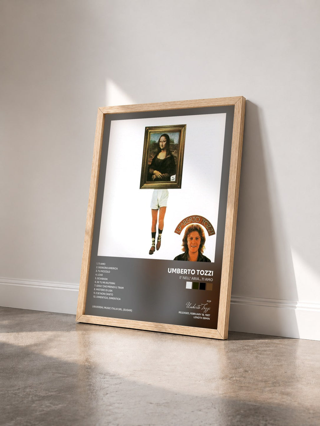 #bois Tableau de l'album E' nell' aria…ti amo de Umberto Tozzi vu de trois quarts, cadre en bois brut