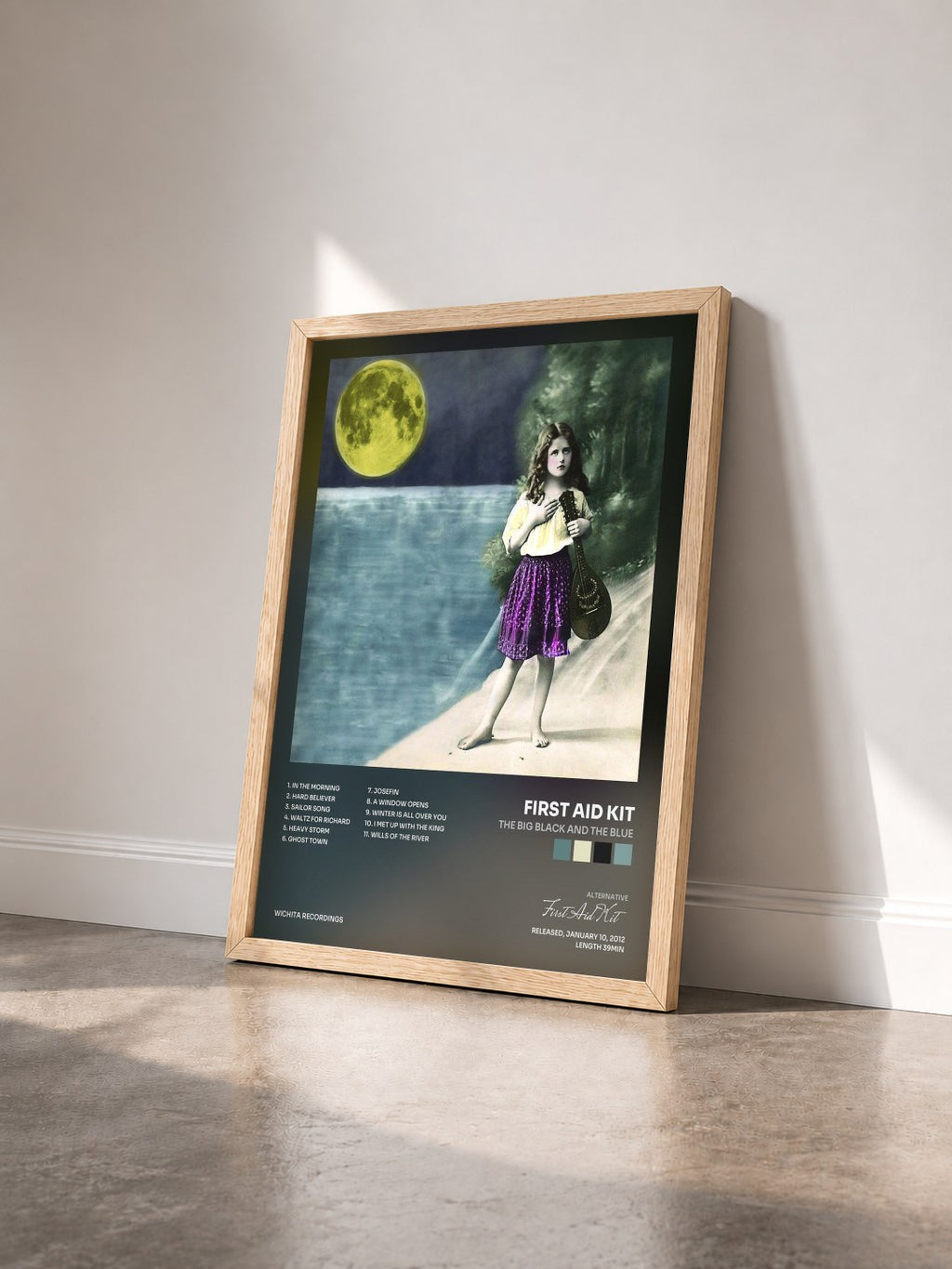 #bois Tableau de l'album The Big Black and the Blue de First Aid Kit vu de trois quarts, cadre en bois brut