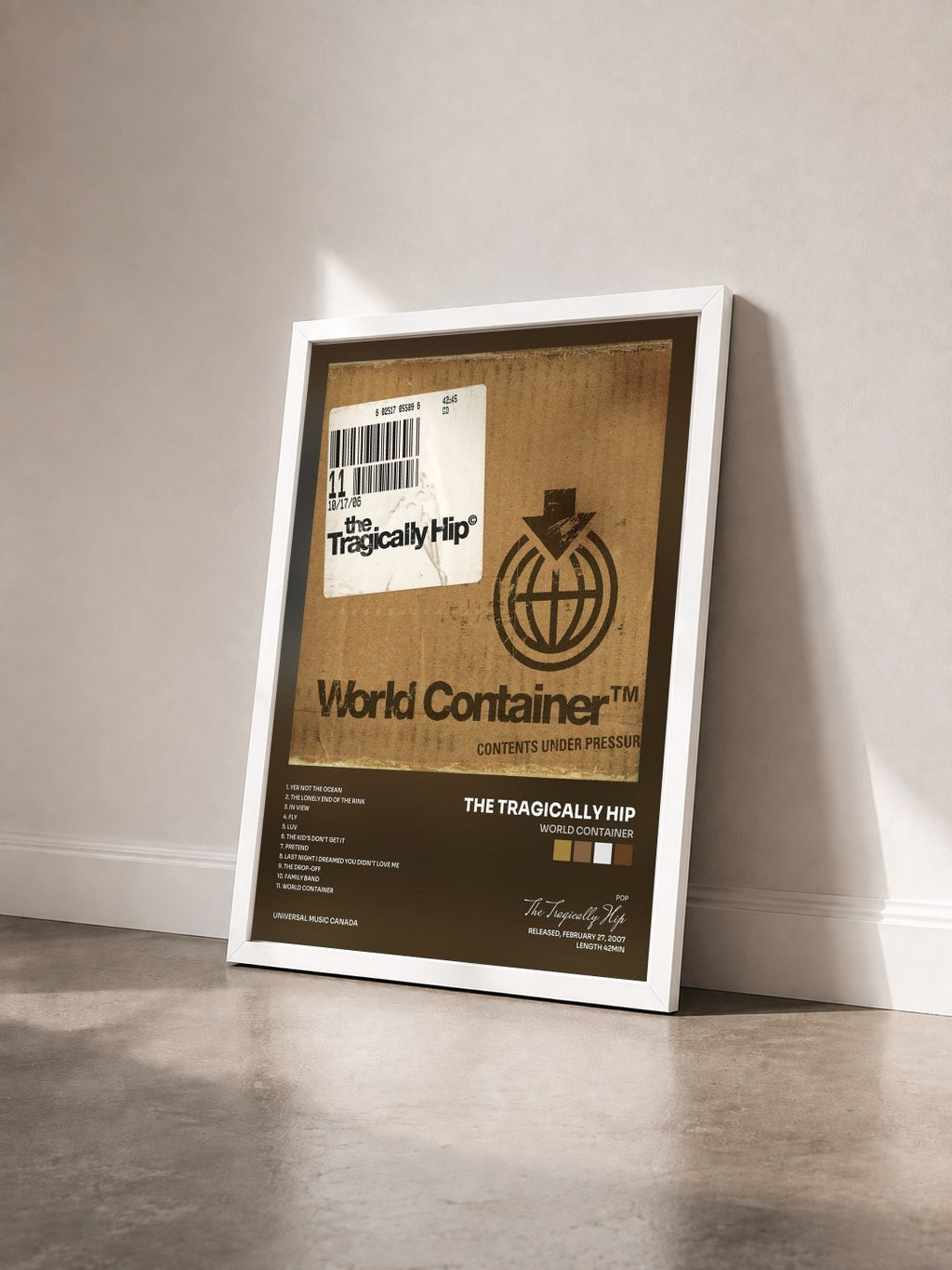 #blanc Tableau de l'album World Container de The Tragically Hip vu de trois quarts, cadre blanc