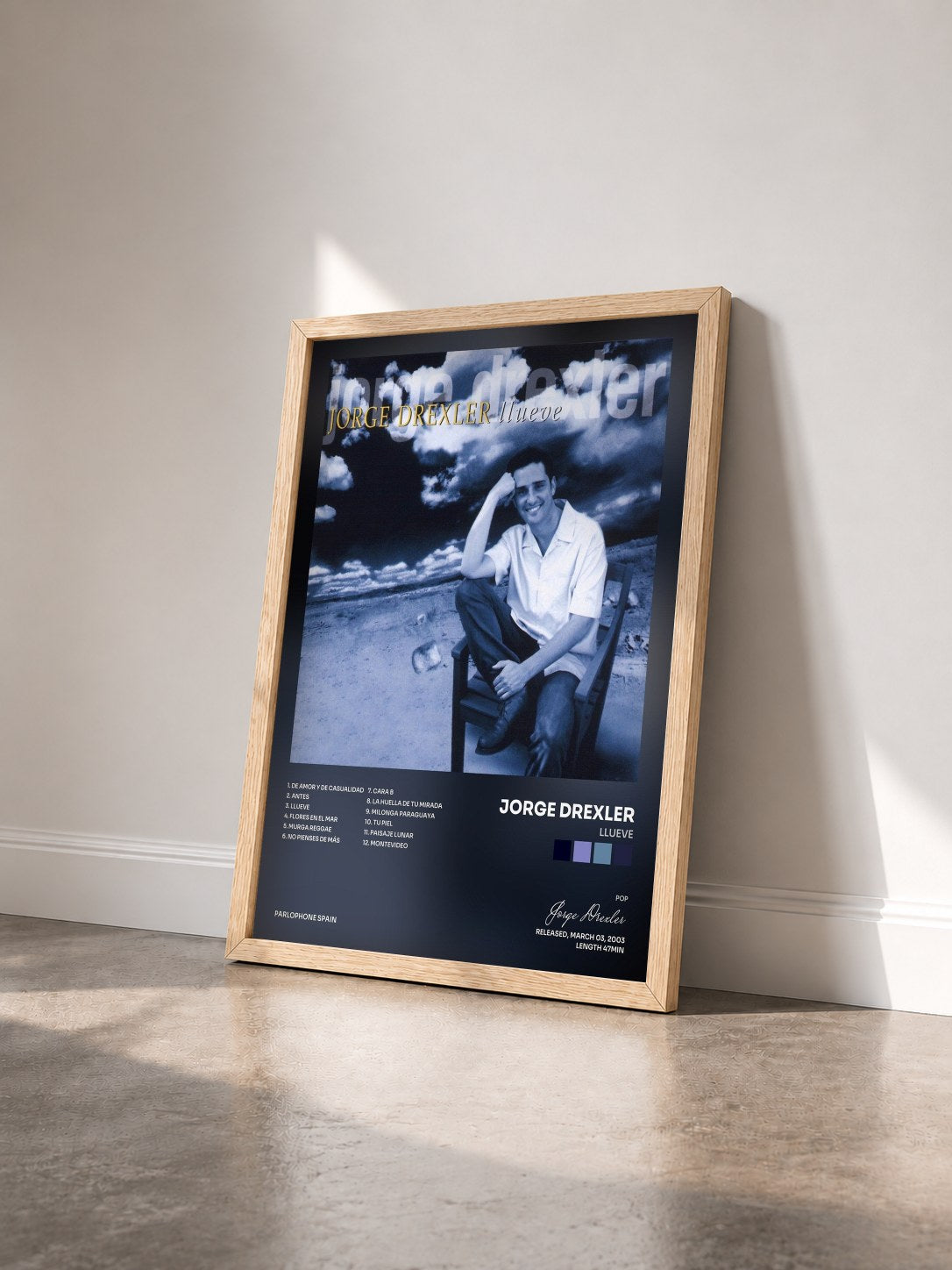 #bois Tableau de l'album Llueve de Jorge Drexler vu de trois quarts, cadre en bois brut