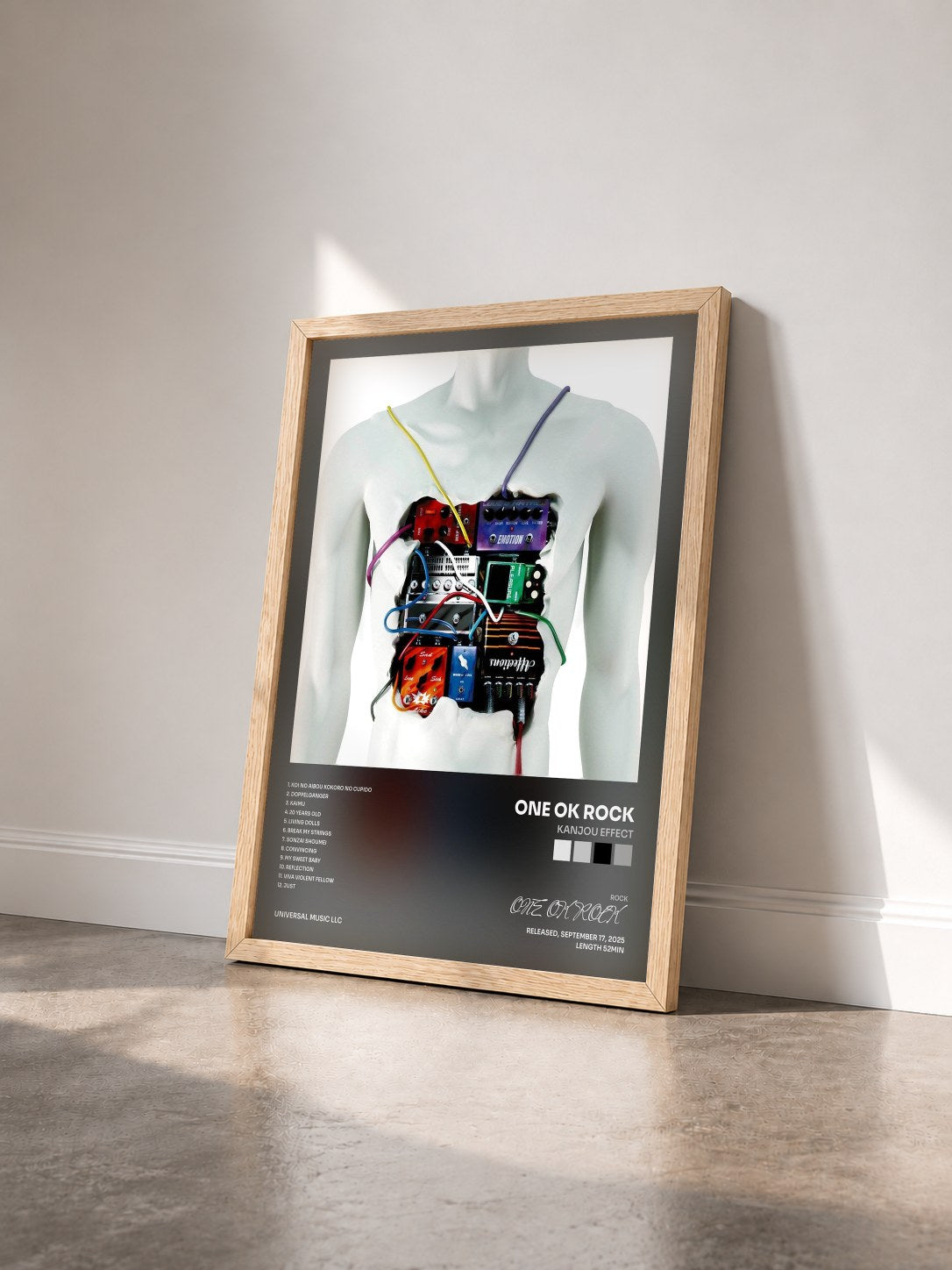 #bois Tableau de l'album Kanjou Effect de ONE OK ROCK vu de trois quarts, cadre en bois brut