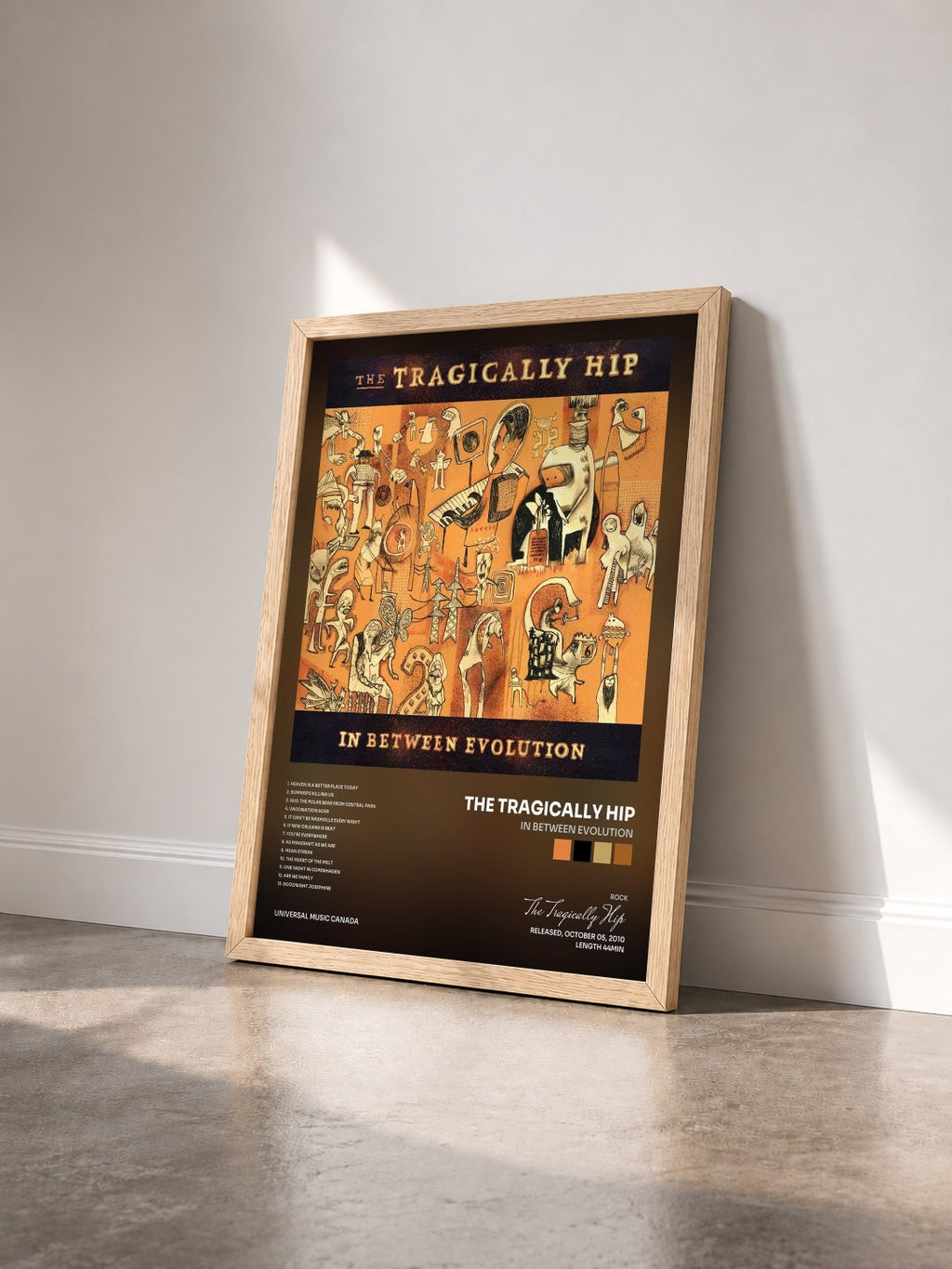 #bois Tableau de l'album In Between Evolution de The Tragically Hip vu de trois quarts, cadre en bois brut