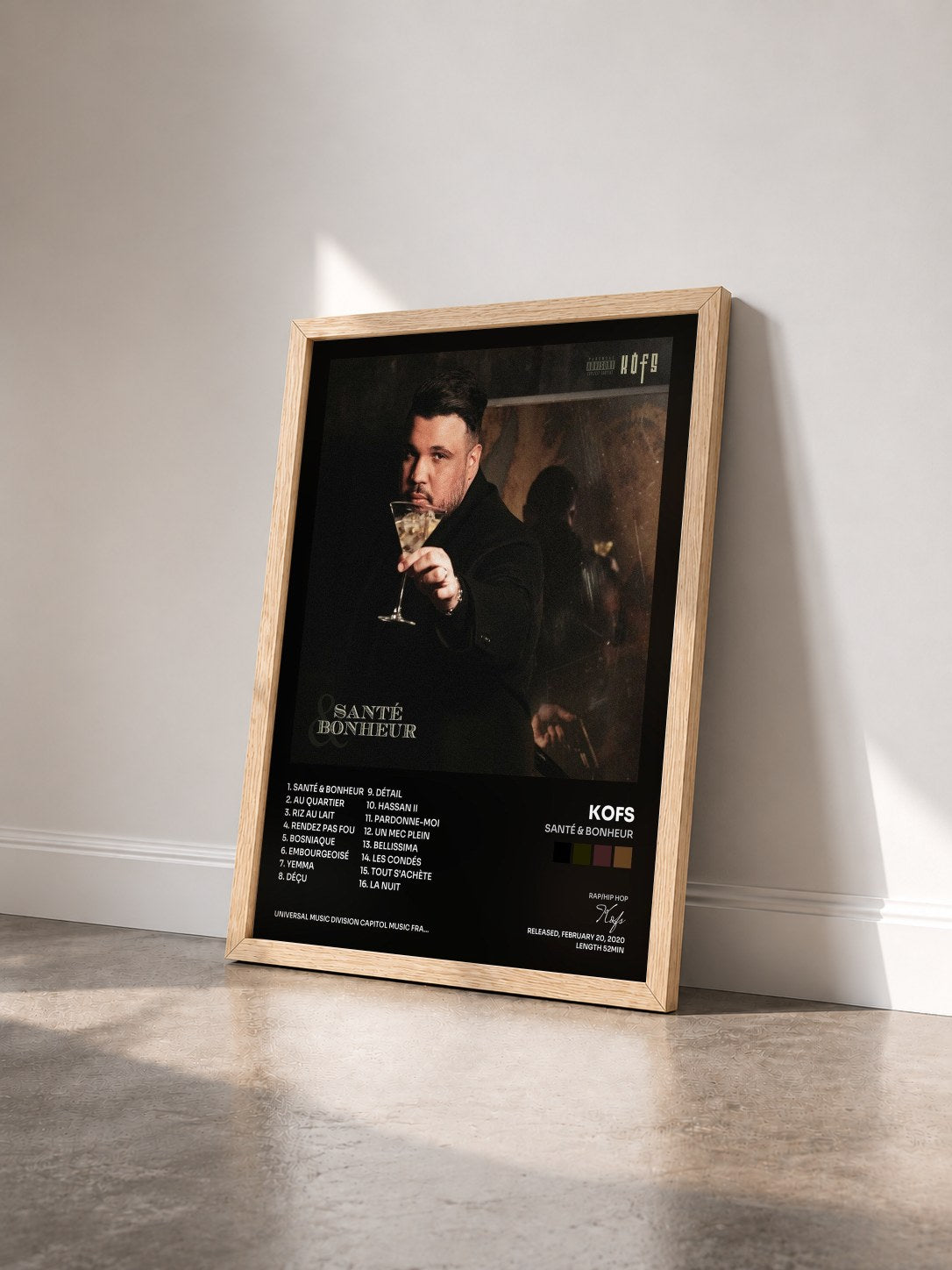 #bois Tableau de l'album Santé & Bonheur de Kofs vu de trois quarts, cadre en bois brut