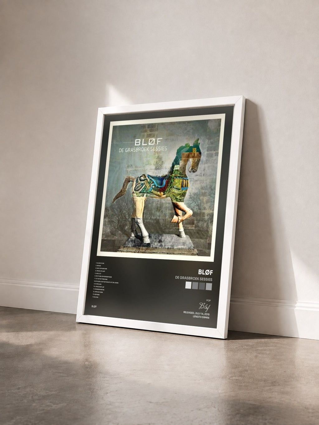 #blanc Tableau de l'album De Grasbroek Sessies de Bløf vu de trois quarts, cadre blanc