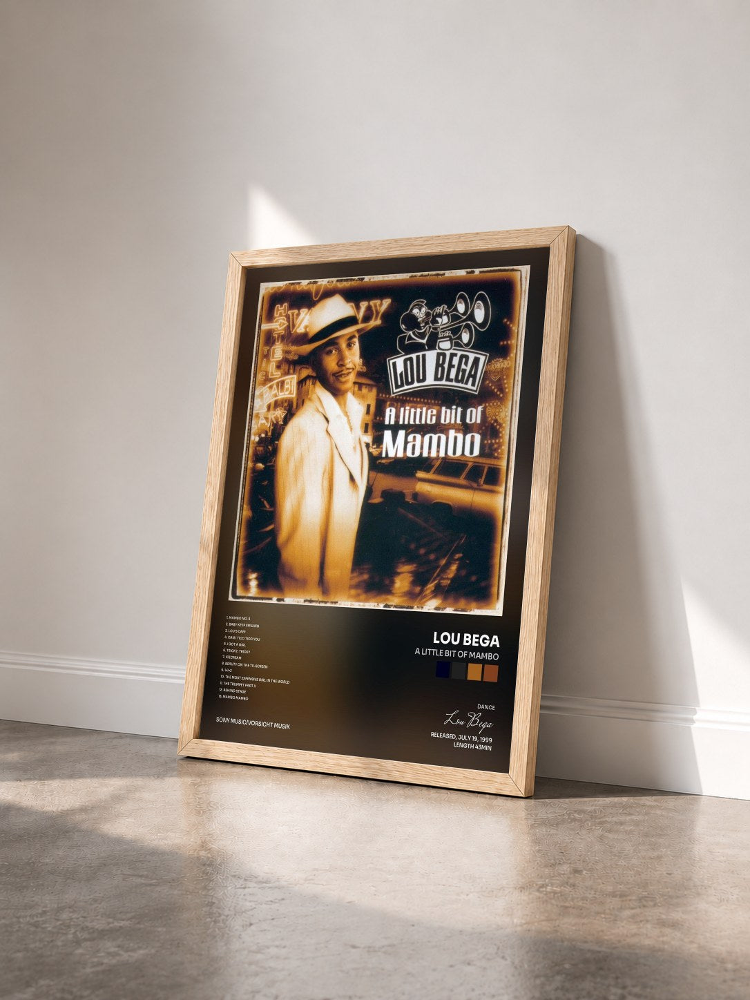 #bois Tableau de l'album A Little Bit of Mambo de Lou Bega vu de trois quarts, cadre en bois brut