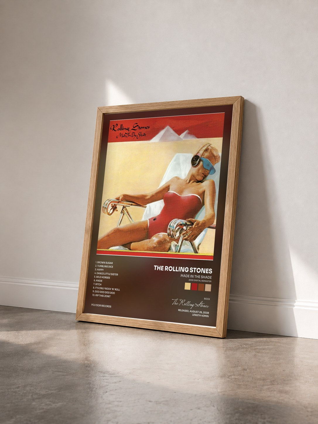 #bois Tableau de l'album Made In The Shade (2005 Digital Remaster) de The Rolling Stones vu de trois quarts, cadre en bois brut