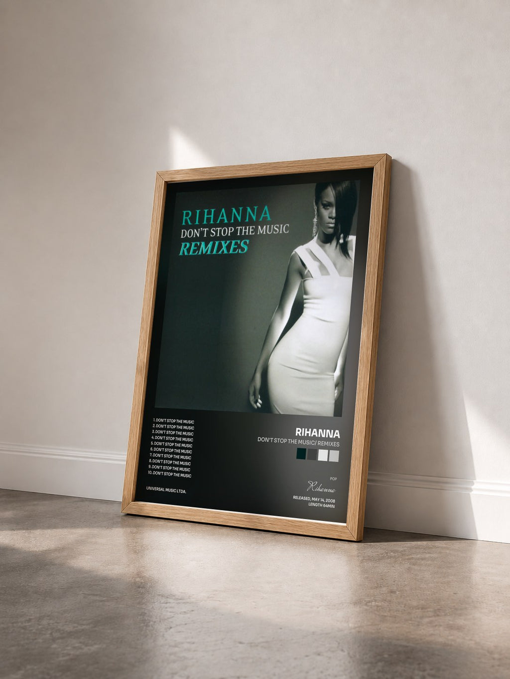 #bois Tableau de l'album Don't Stop The Music/ Remixes de Rihanna vu de trois quarts, cadre en bois brut