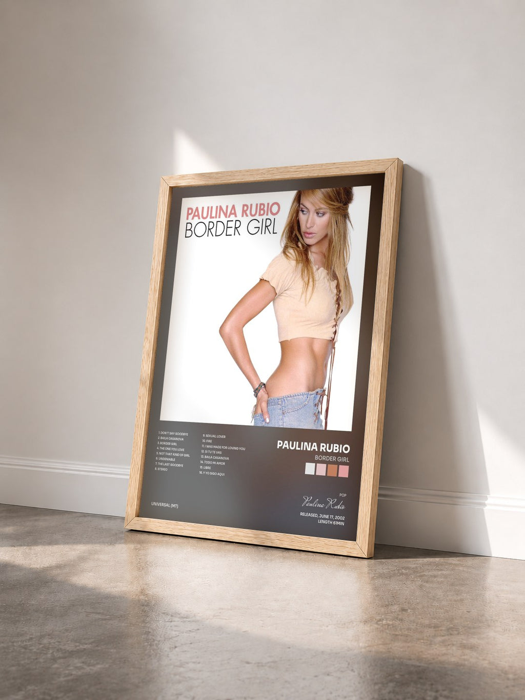 #bois Tableau de l'album Border Girl de Paulina Rubio vu de trois quarts, cadre en bois brut