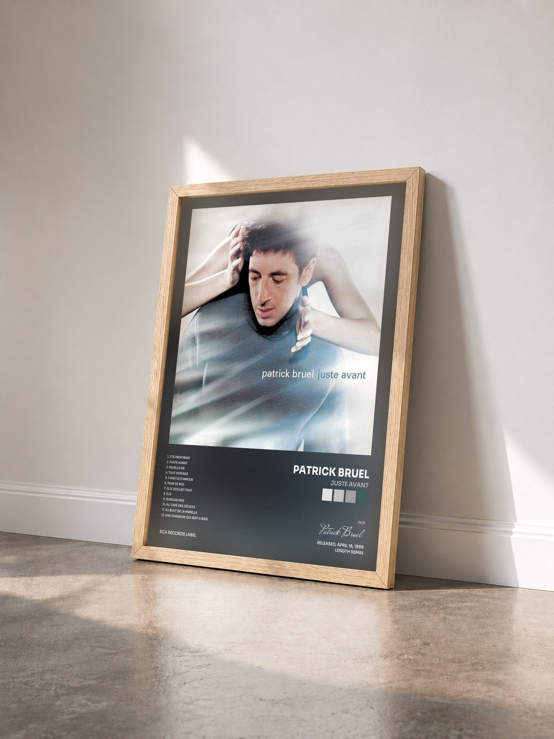 #bois Tableau de l'album Juste Avant de Patrick Bruel vu de trois quarts, cadre en bois brut