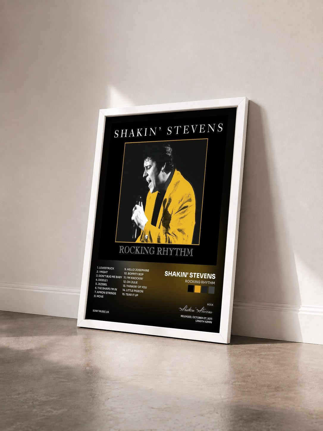 #blanc Tableau de l'album Rocking Rhythm de Shakin' Stevens vu de trois quarts, cadre blanc