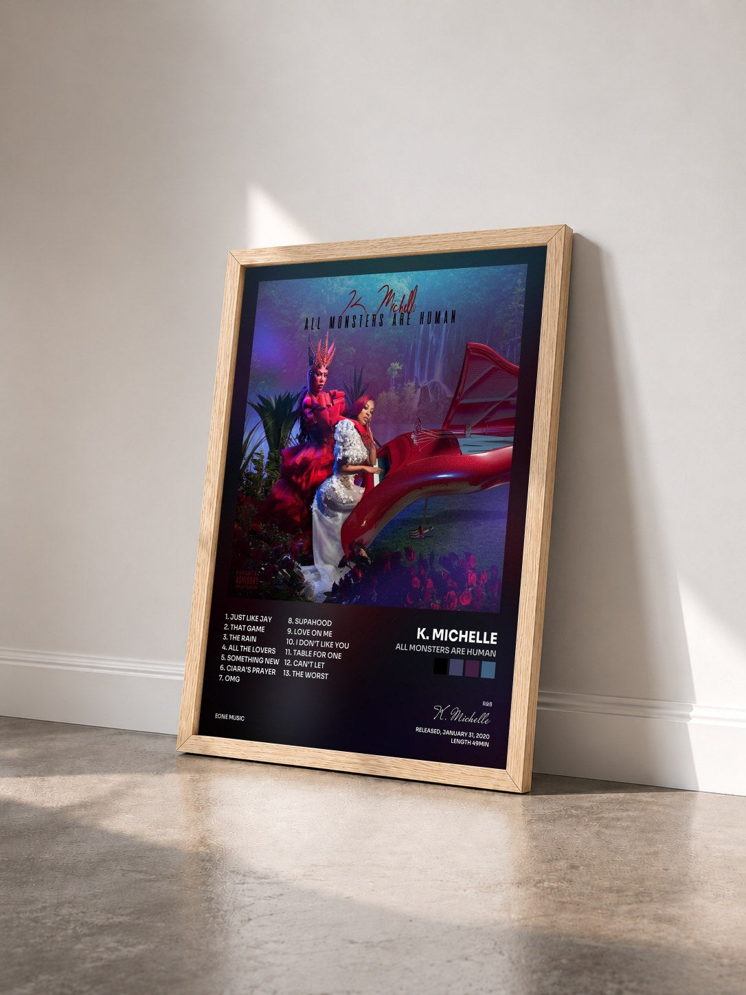 #bois Tableau de l'album All Monsters Are Human de K. Michelle vu de trois quarts, cadre en bois brut