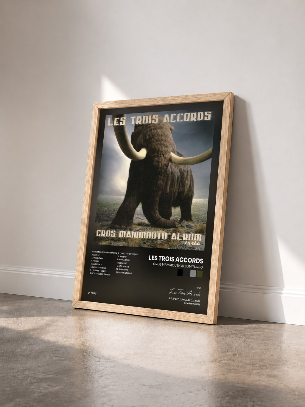 #bois Tableau de l'album Gros mammouth album turbo de Les Trois Accords vu de trois quarts, cadre en bois brut