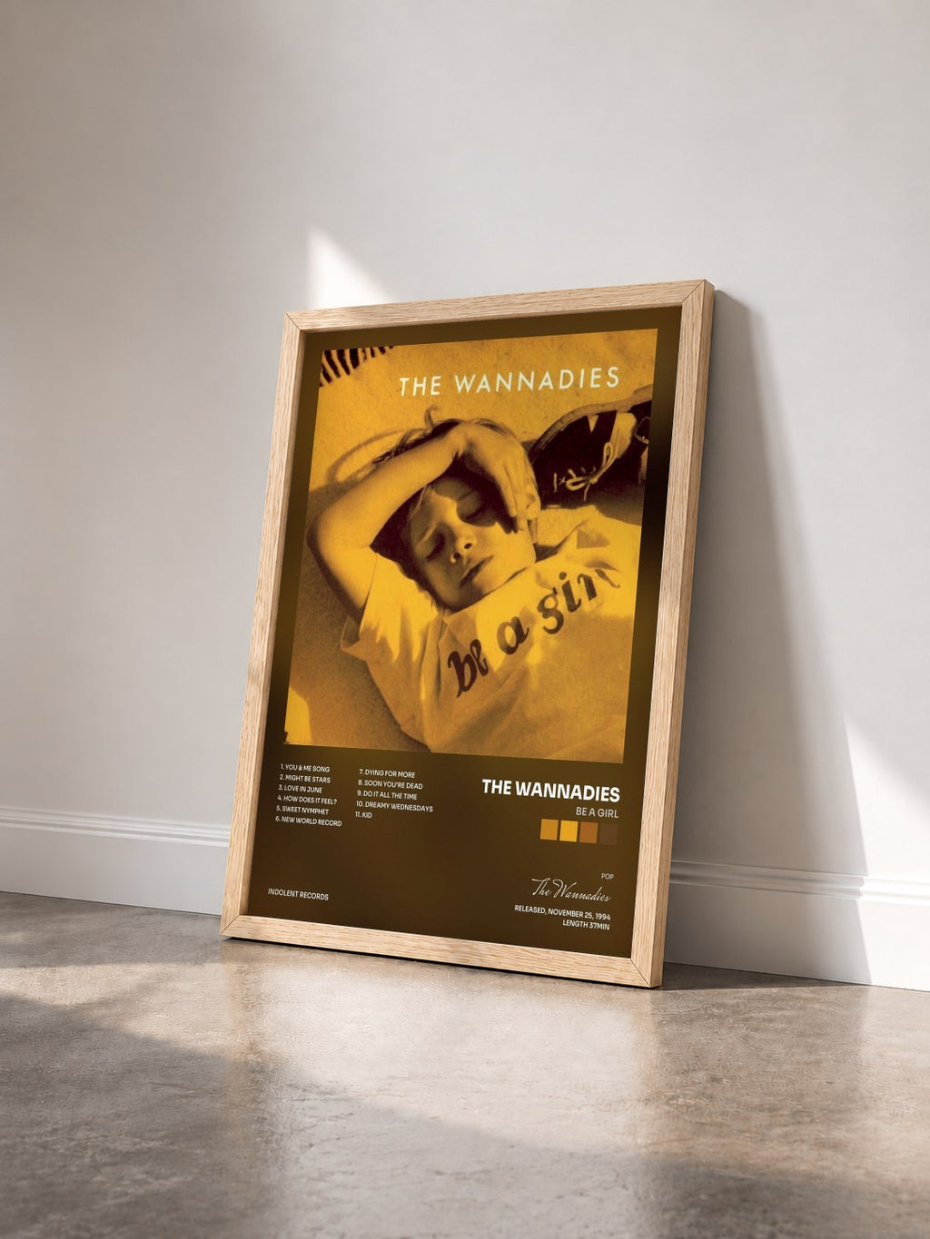 #bois Tableau de l'album Be A Girl de The Wannadies vu de trois quarts, cadre en bois brut