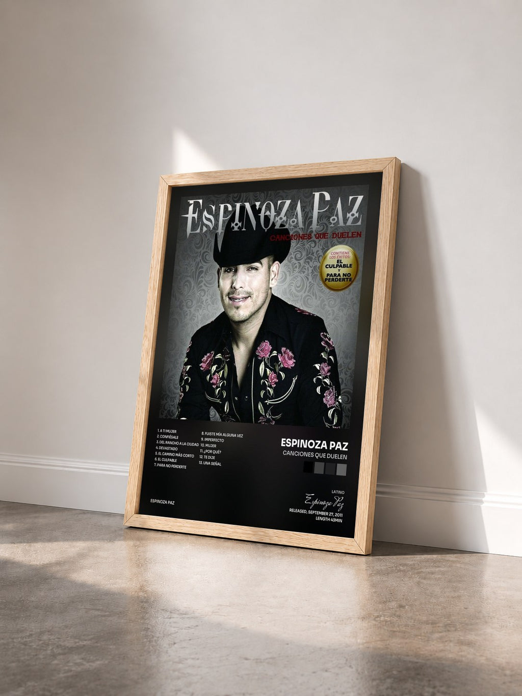 #bois Tableau de l'album Canciones Que Duelen de Espinoza Paz vu de trois quarts, cadre en bois brut