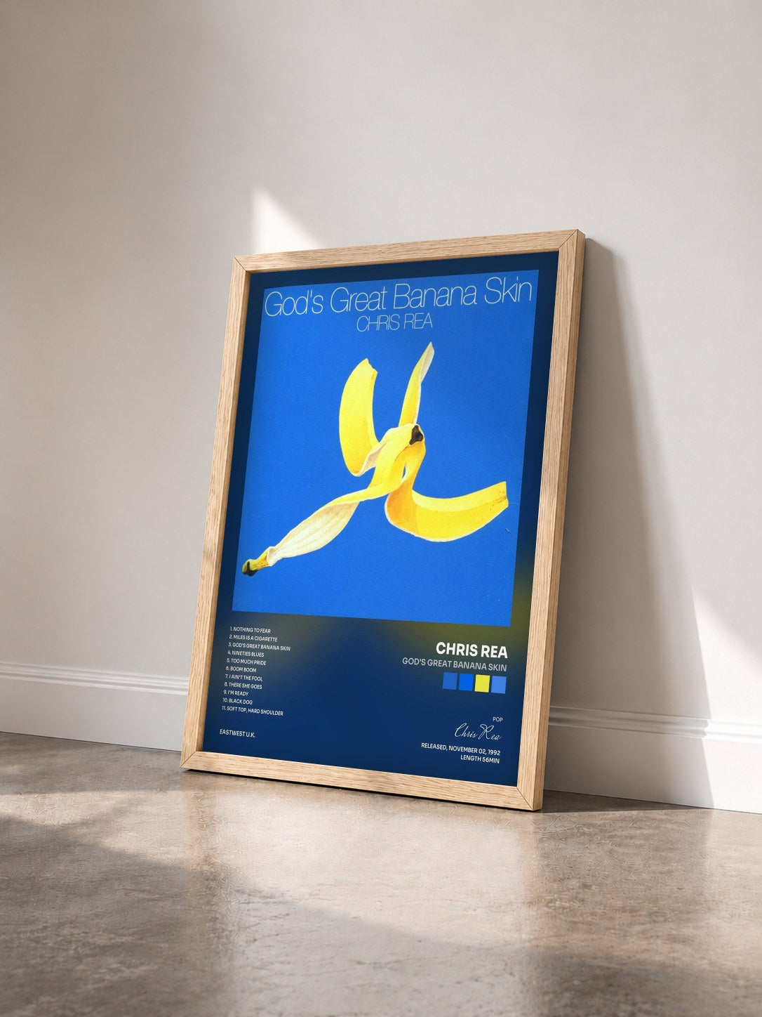 #bois Tableau de l'album God's Great Banana Skin de Chris Rea vu de trois quarts, cadre en bois brut